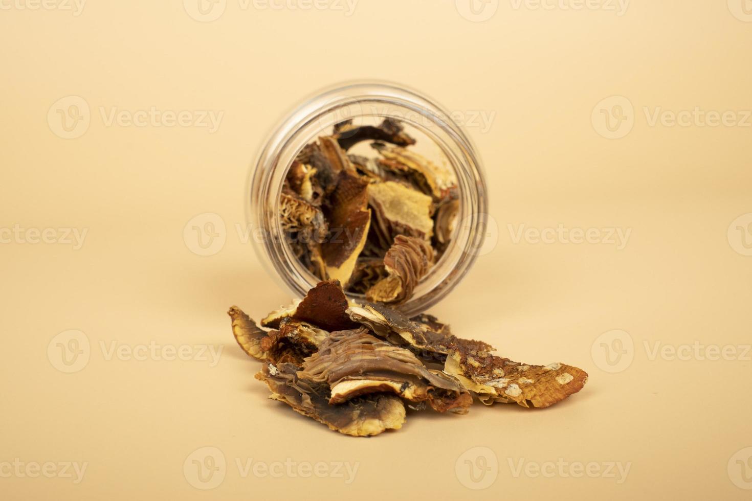 dried fly agaric in a jar for the microdosing use closeup, hack mind mushrooms photo