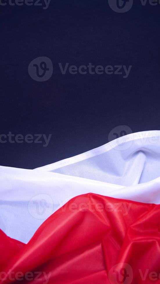 Folded White and Red Flag of Poland photo