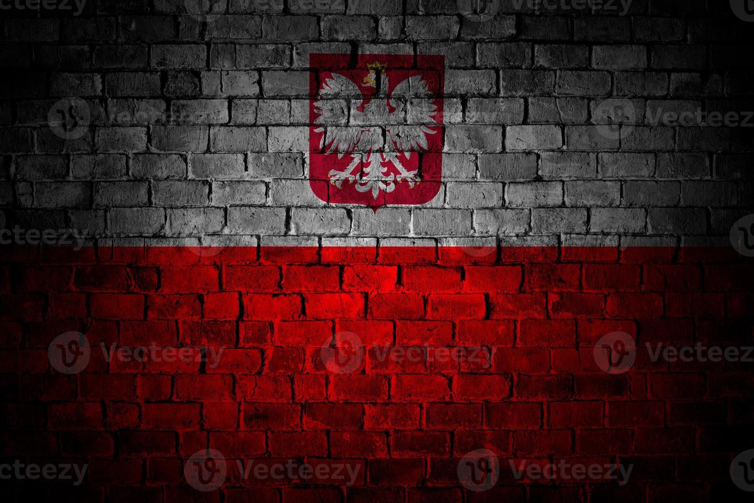 Flag of Poland painted on a brick wall in an urban location photo