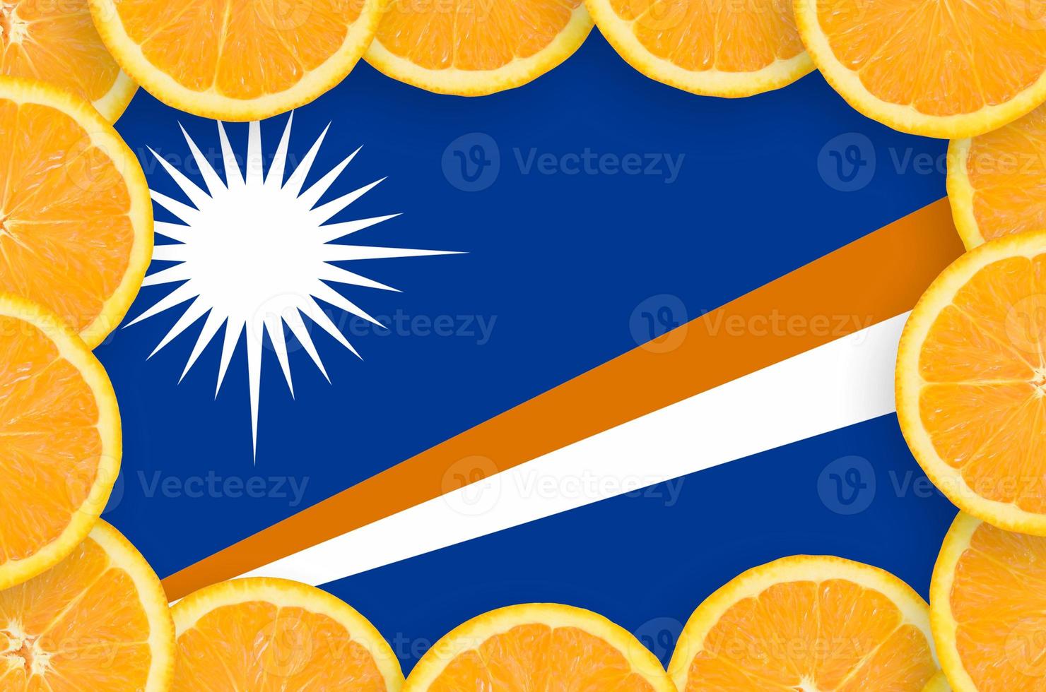 Marshall Islands flag in fresh citrus fruit slices frame photo