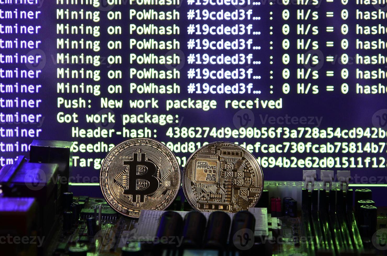 The digital process of cryptocurrency mining by using the GPUs. Bitcoins and video card on a working display and mining screen photo