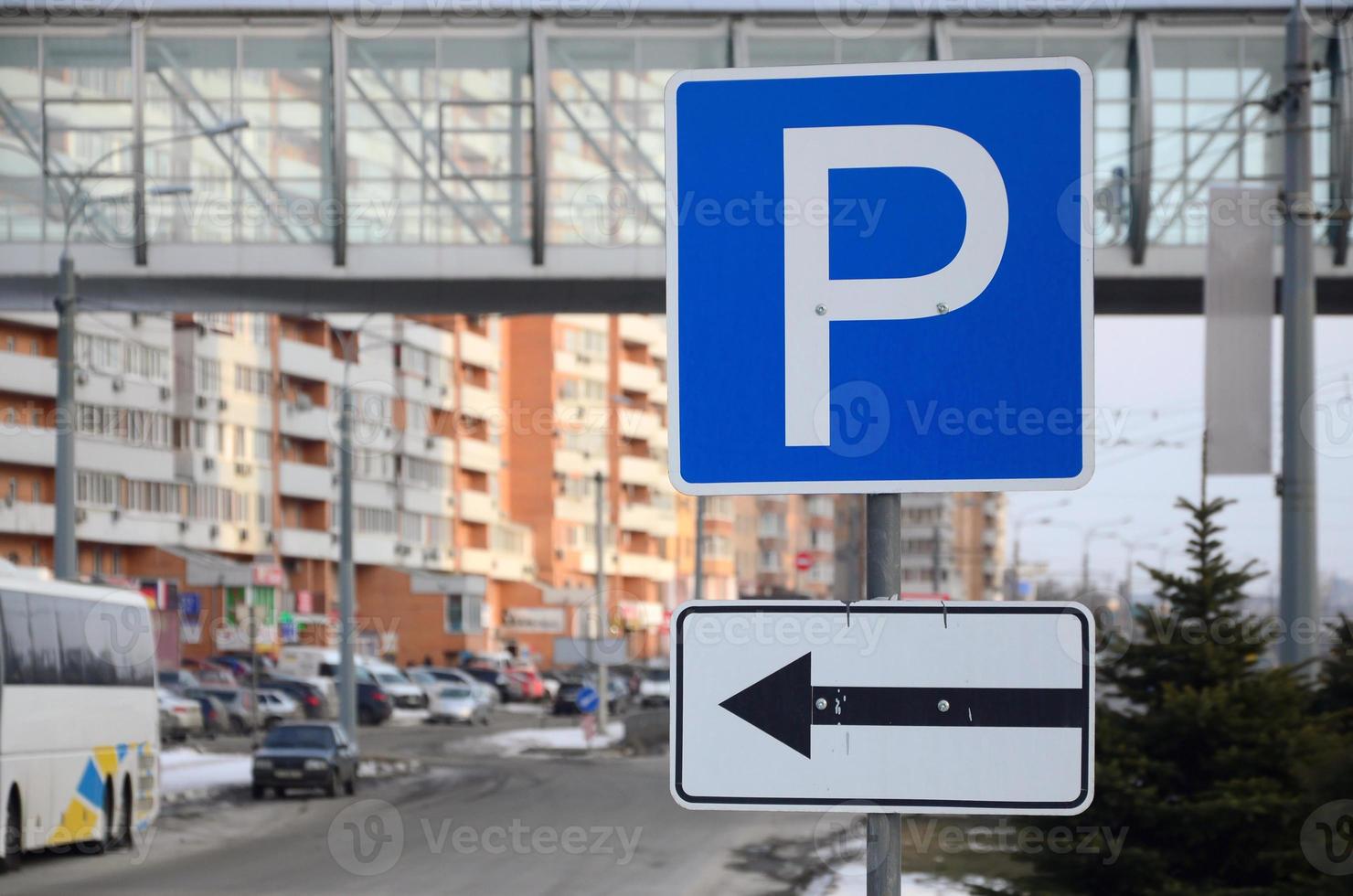 Parking left. Traffic sign with the letter P and the arrows to the left photo