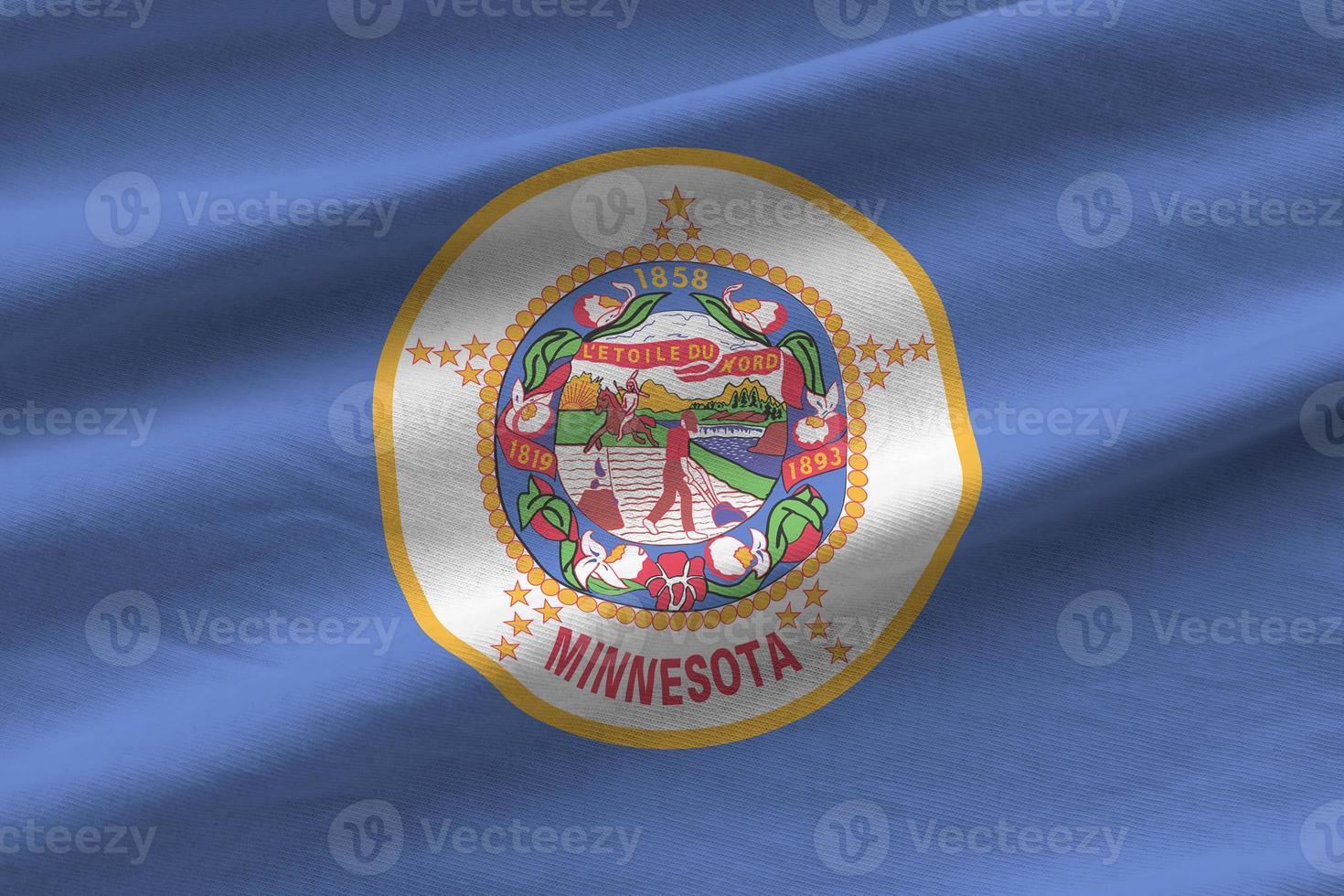Minnesota US state flag with big folds waving close up under the studio light indoors. The official symbols and colors in banner photo