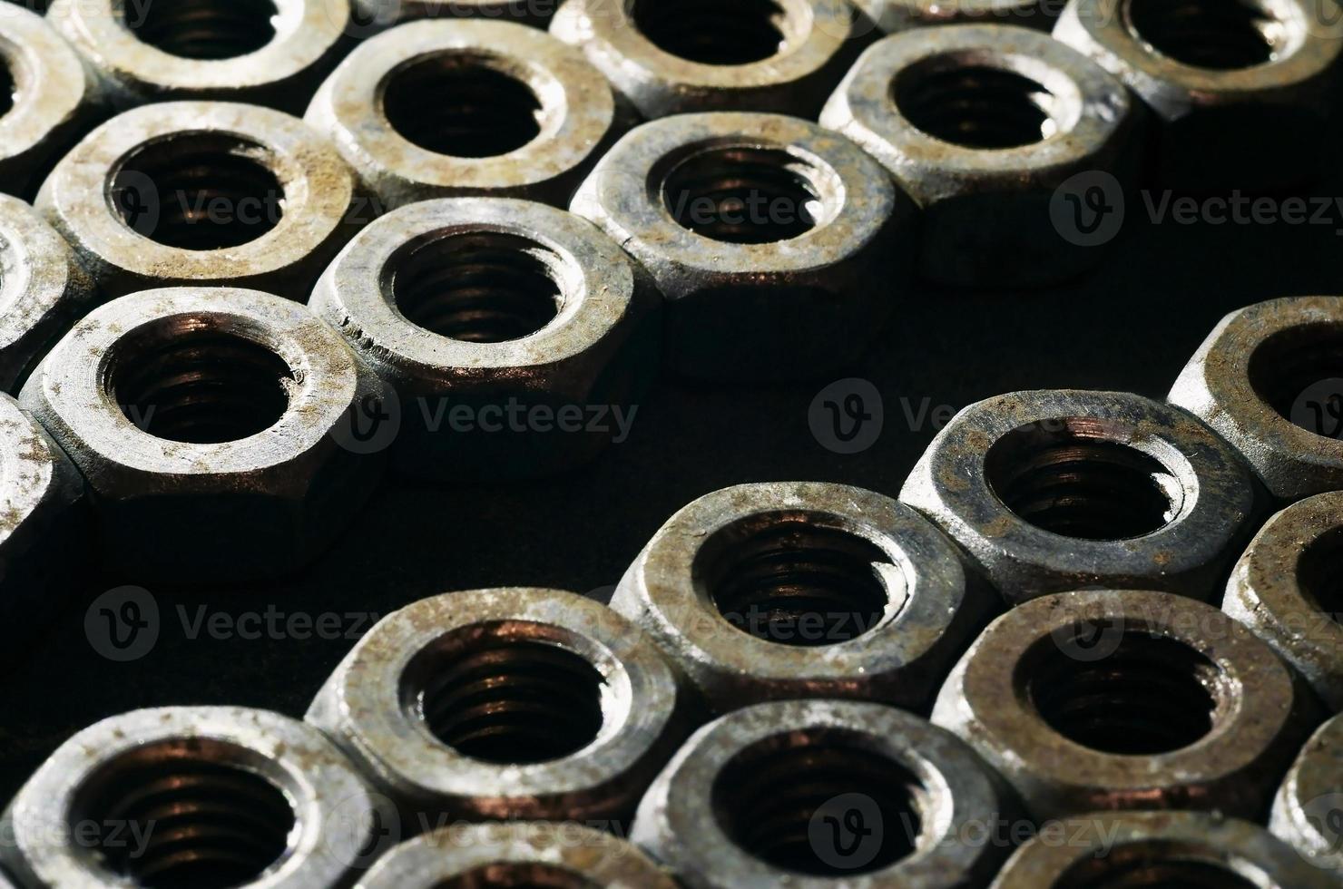 Close-up of rusty nuts photo