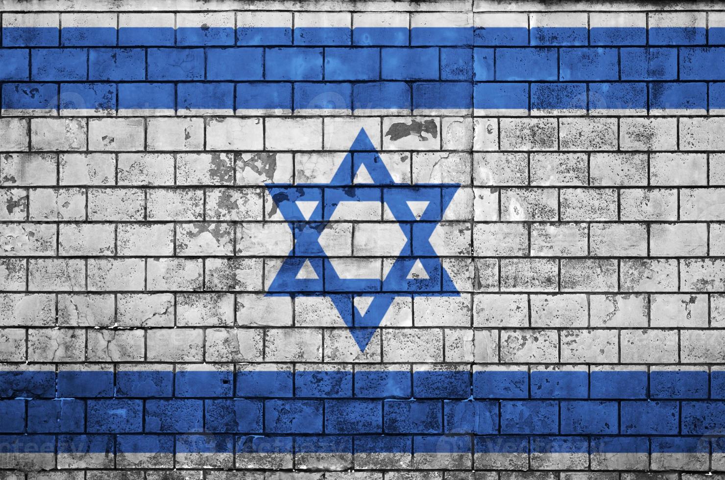 Israel flag is painted onto an old brick wall photo