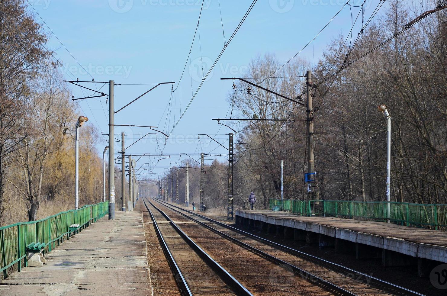 A railway station with platforms for waiting for trains photo