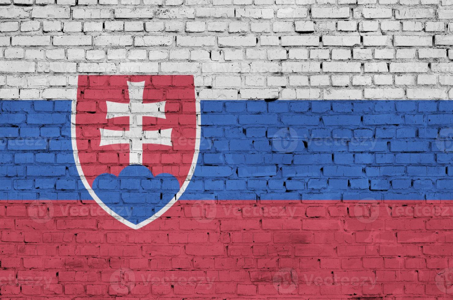 Slovakia flag is painted onto an old brick wall photo