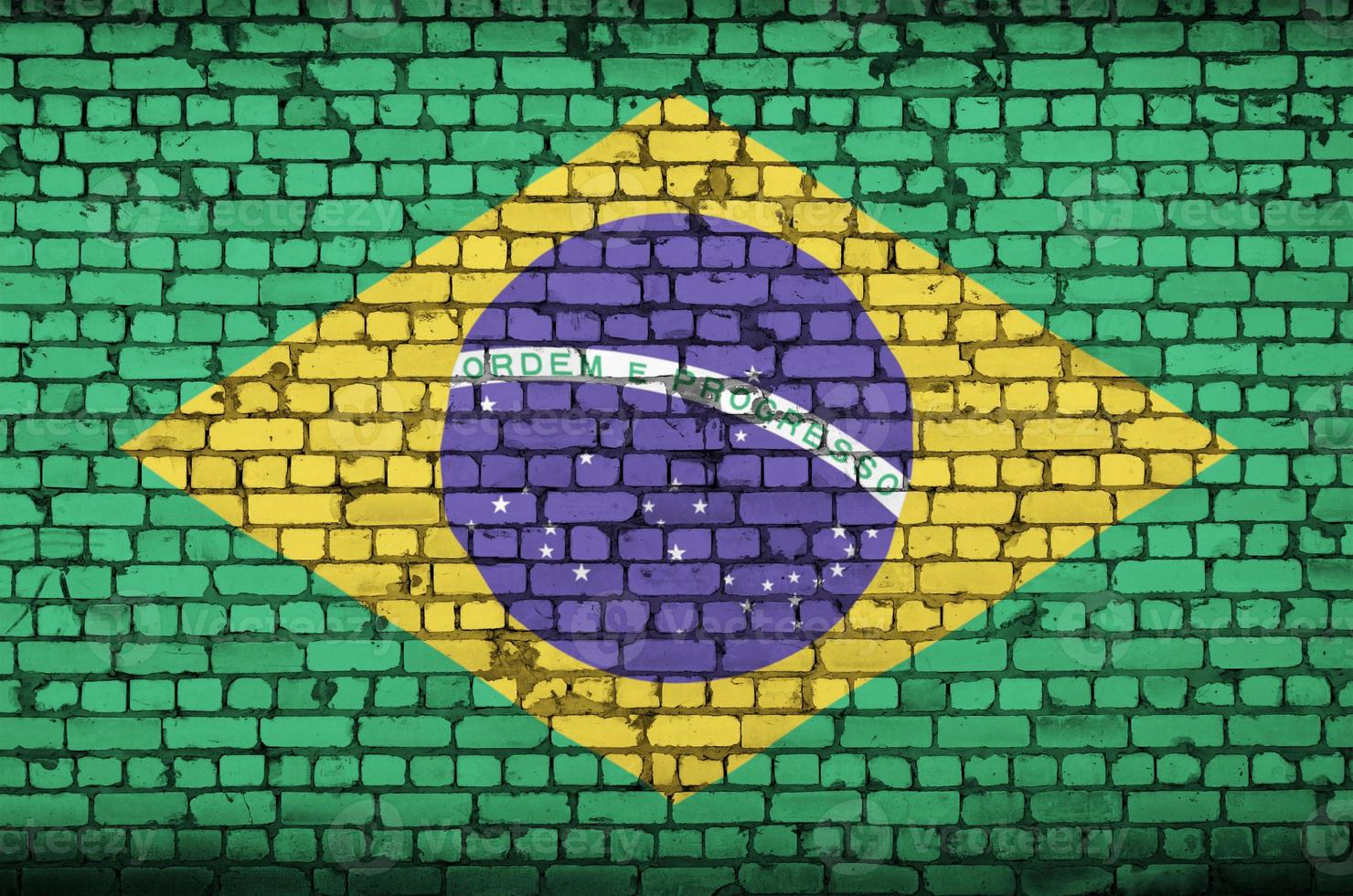 Brazil flag is painted onto an old brick wall photo