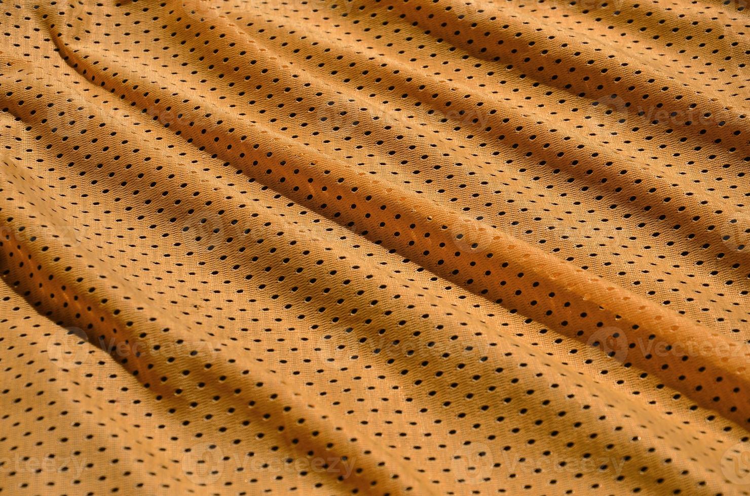 Texture of sportswear made of polyester fiber. Outerwear for sports training has a mesh texture of stretchable nylon fabric photo