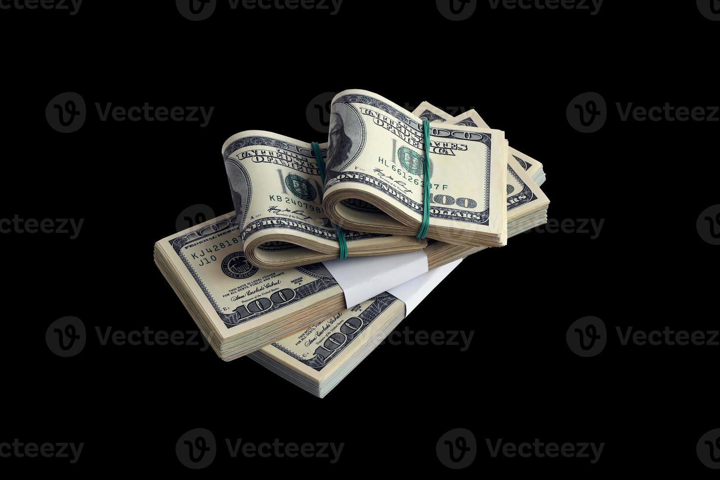 Bundle of US dollar bills isolated on black. Pack of american money with high resolution on perfect black background photo