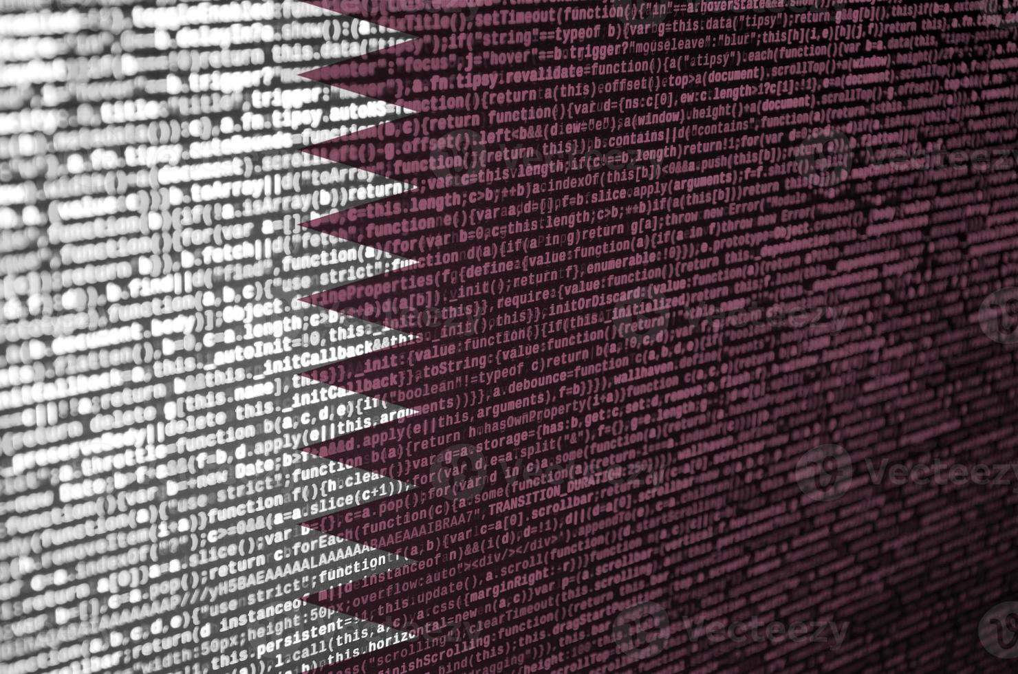 Qatar flag is depicted on the screen with the program code. The concept of modern technology and site development photo