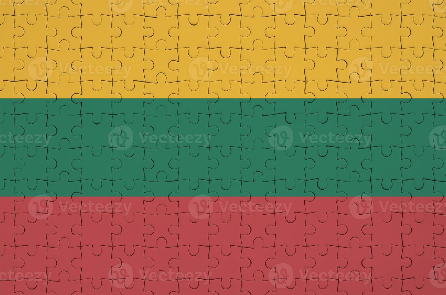 Lithuania flag is depicted on a folded puzzle photo