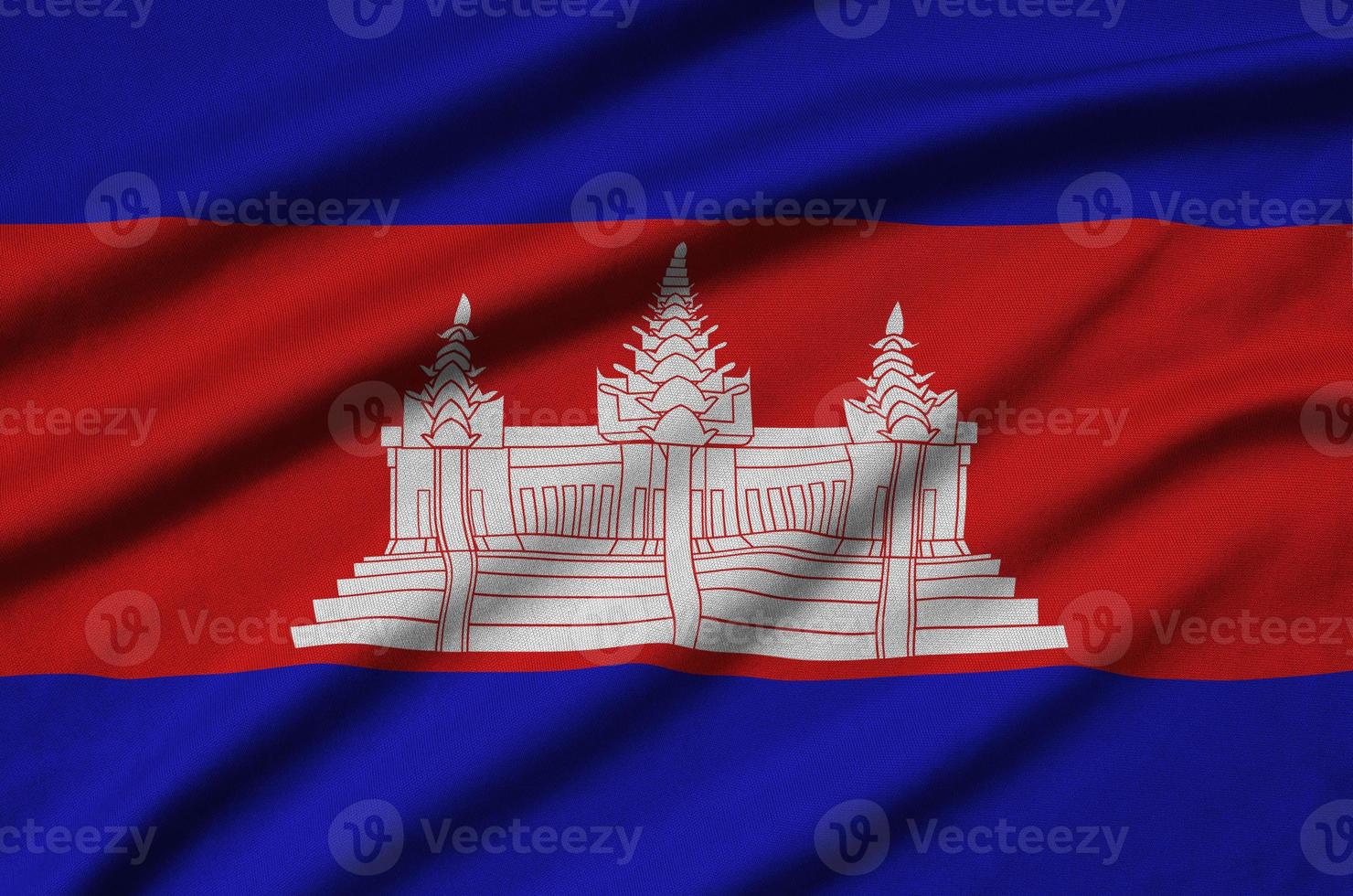 Cambodia flag is depicted on a sports cloth fabric with many folds. Sport team banner photo