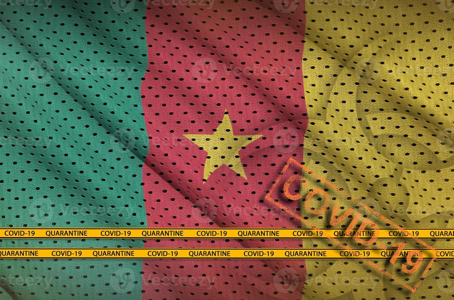 Cameroon flag and orange Covid-19 stamp with border tape. Coronavirus or 2019-nCov virus concept photo