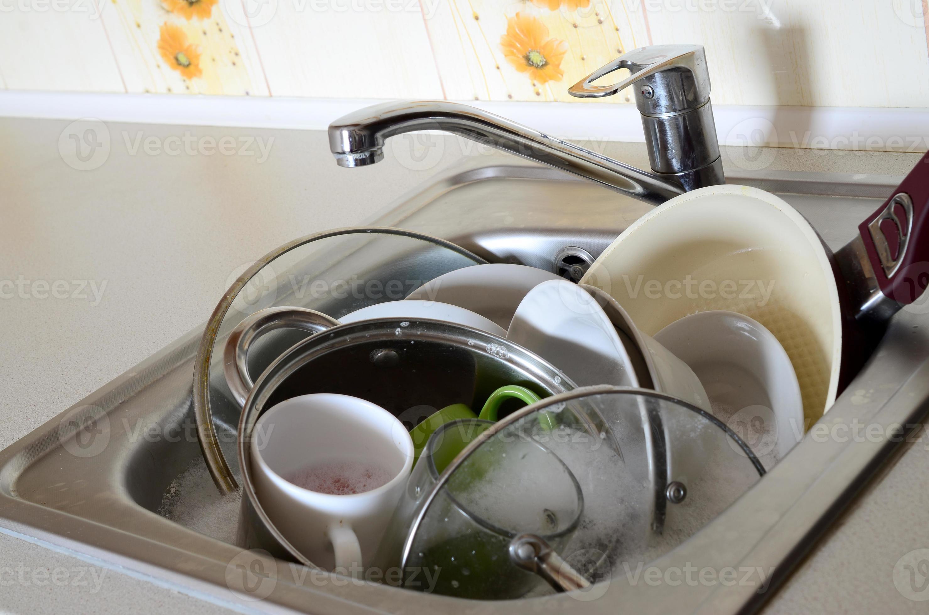 Dirty dishes and unwashed kitchen appliances filled the kitchen sink