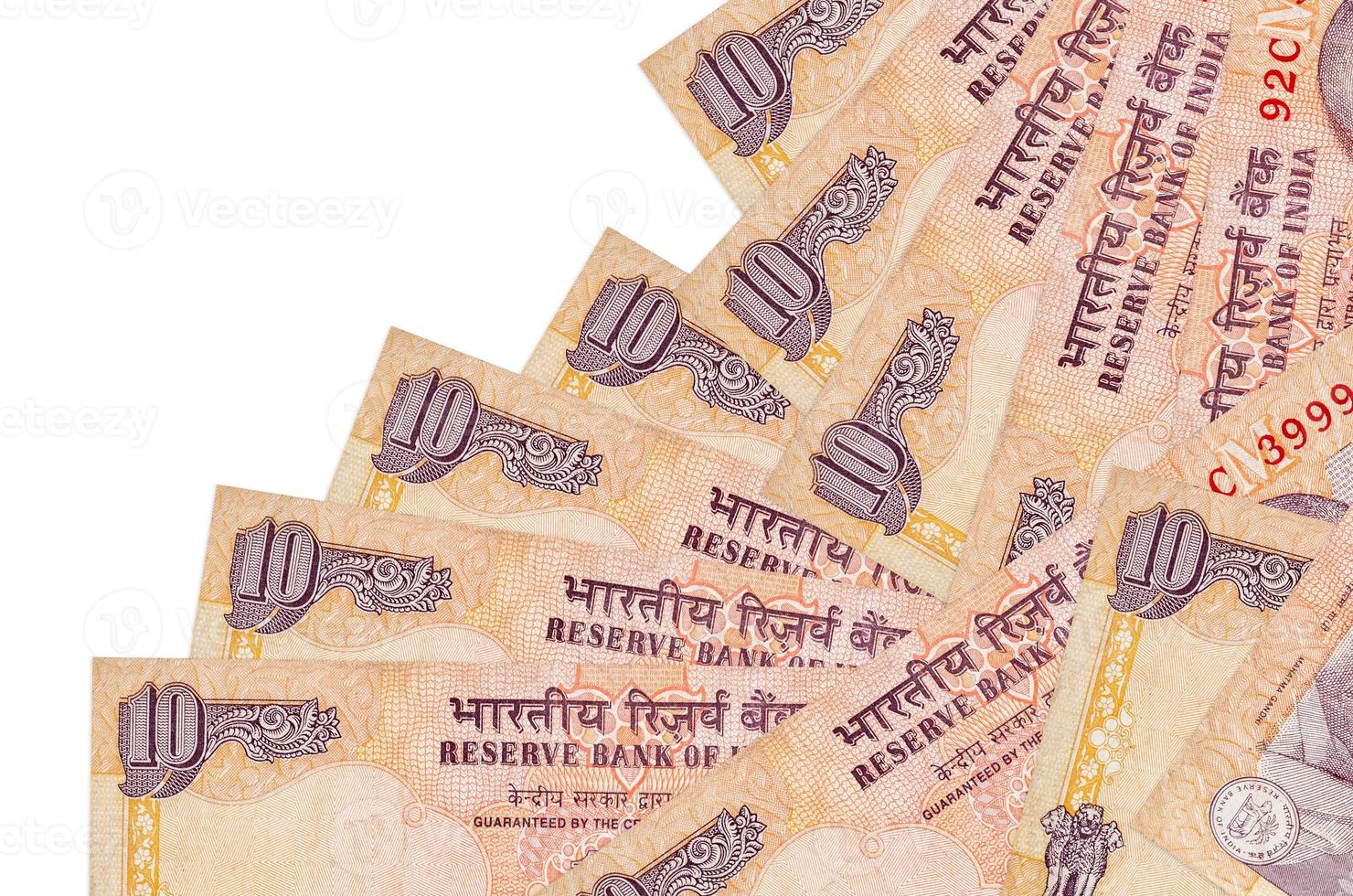 10 Indian rupees bills lies in different order isolated on white. Local banking or money making concept photo