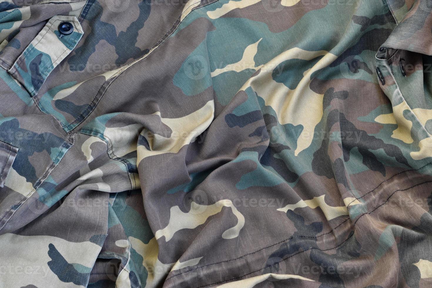 Camouflage background texture as backdrop for army and military design projects photo