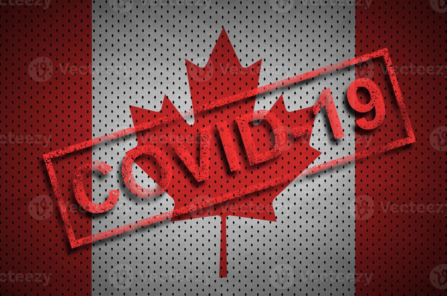 Canada flag and red Covid-19 stamp. Coronavirus 2019-nCov outbreak photo