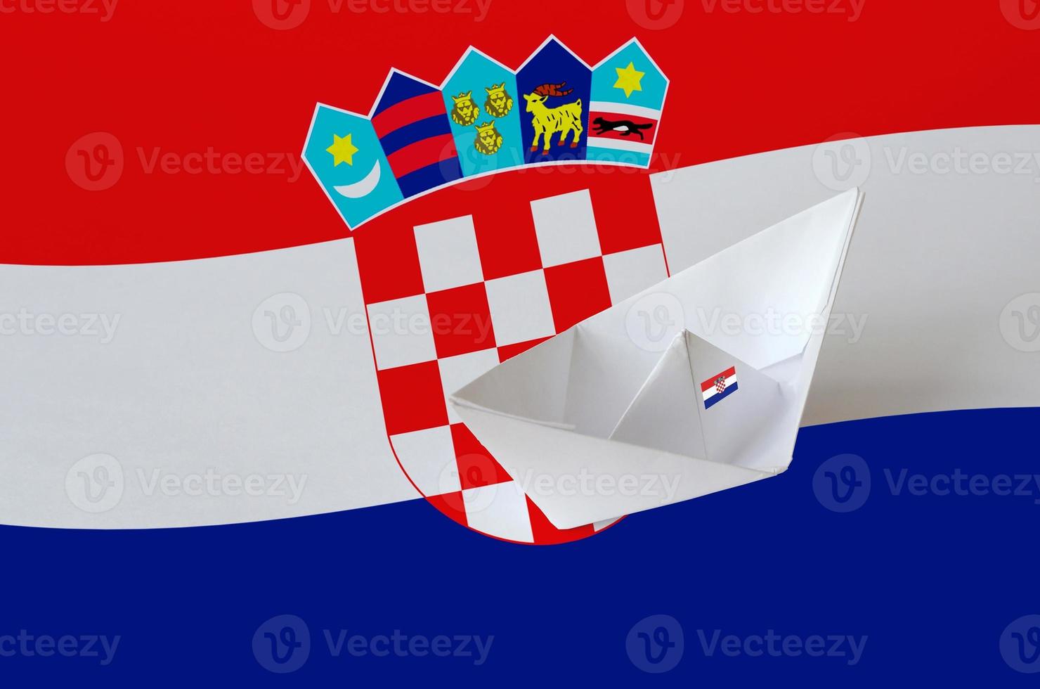 Croatia flag depicted on paper origami ship closeup. Handmade arts concept photo