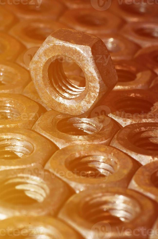 Close-up of rusty nuts photo