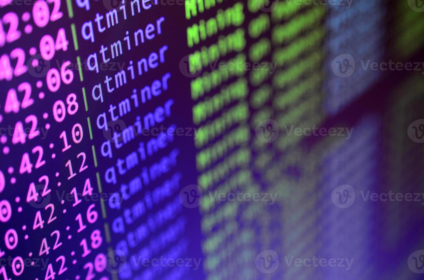 Macro snapshot of the program interface for crypto currency mining on the monitor of an office computer. The concept of mining bitcoins. The flow of information strings and data photo