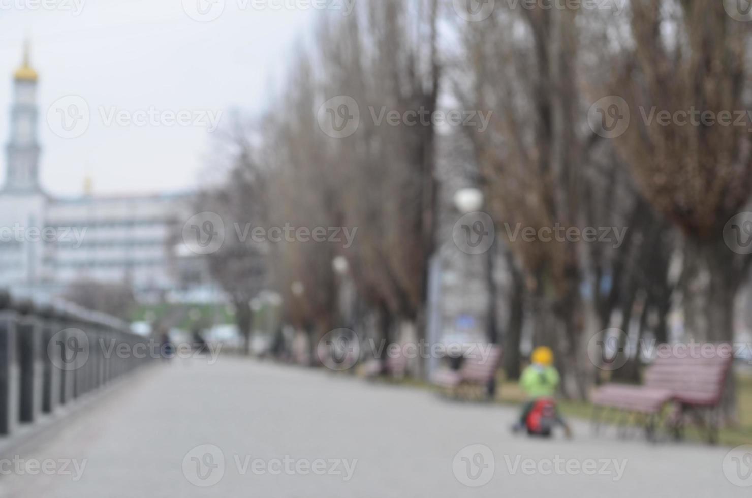 Blurred landscape of spring park near the waterfront photo