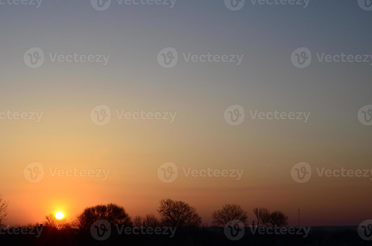 Dawn in the village. Sunrise in the suburban landscape photo