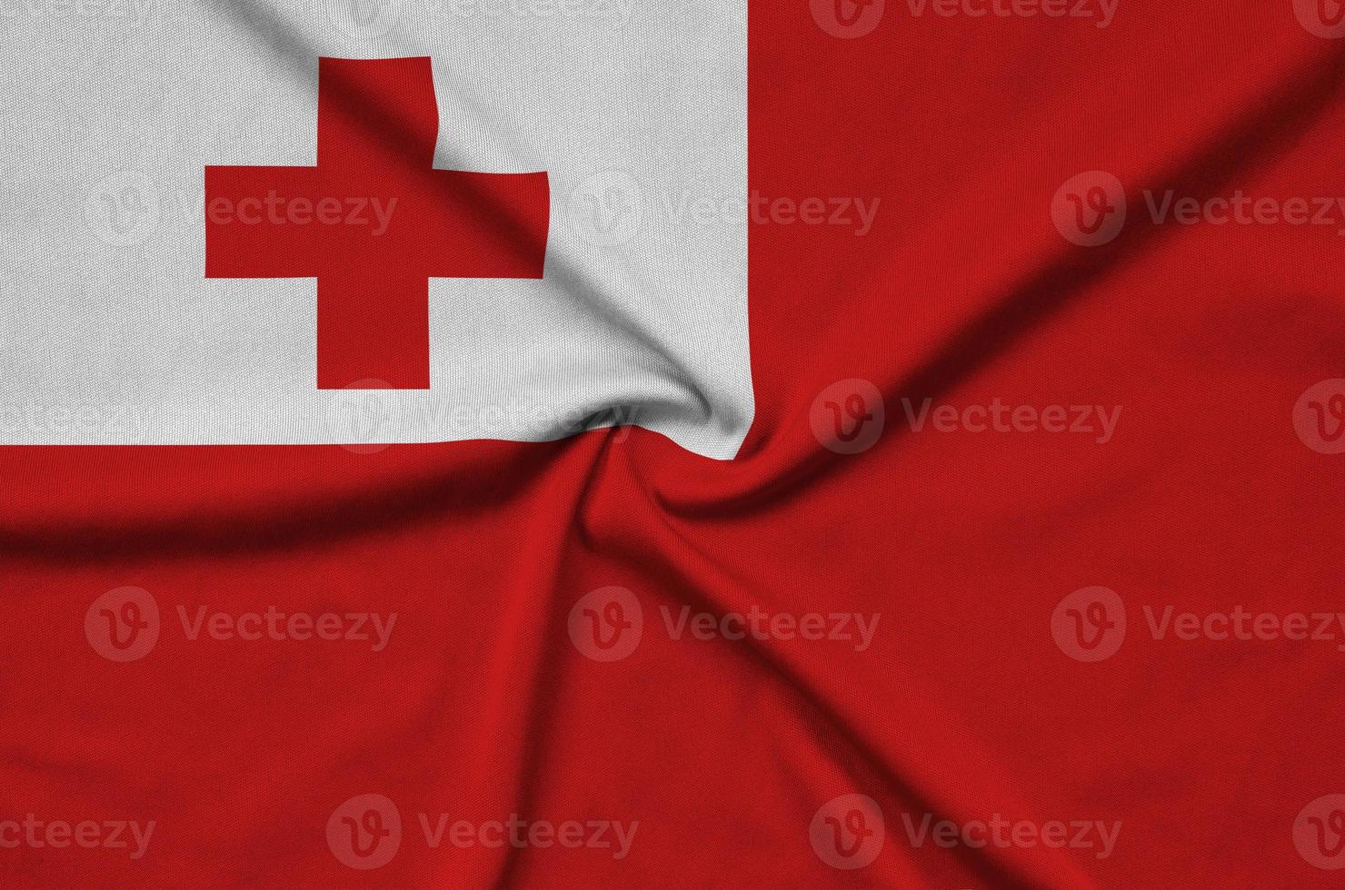 Tonga flag is depicted on a sports cloth fabric with many folds. Sport team banner photo