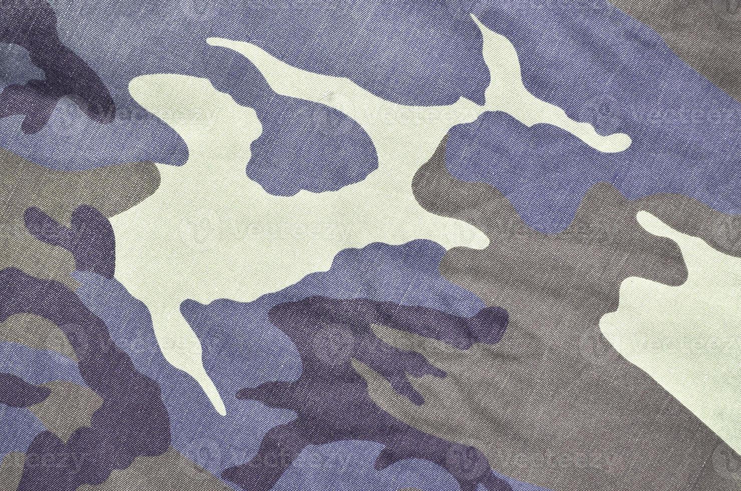 Texture of fabric with a camouflage painted in colors of the marsh. Army background image photo