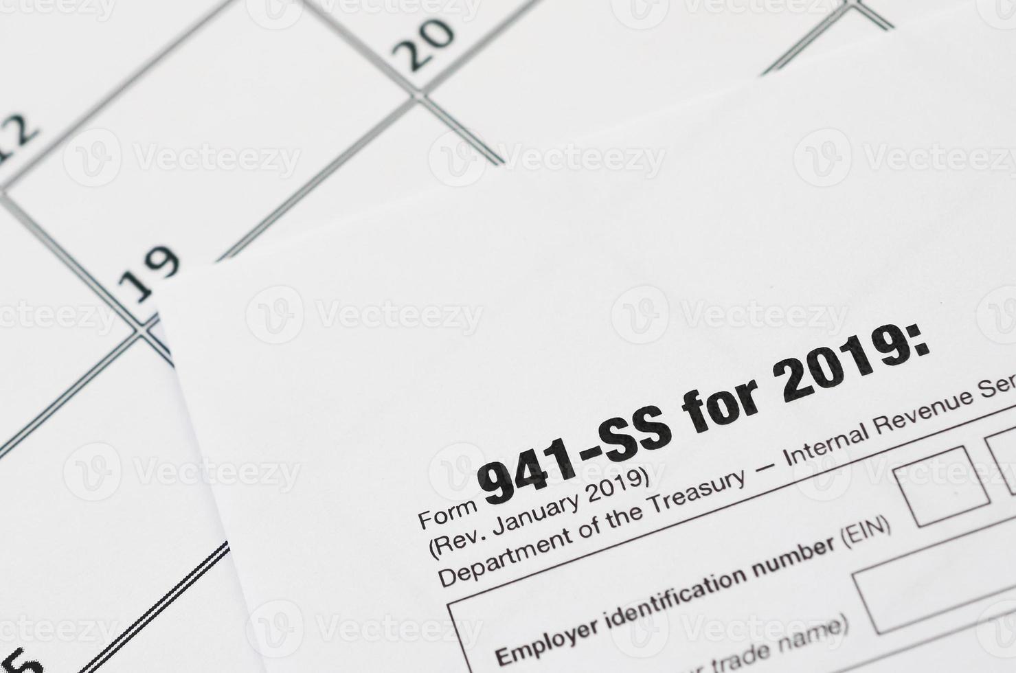 IRS Form 941SS Employer's quarterly federal tax return blank lies on