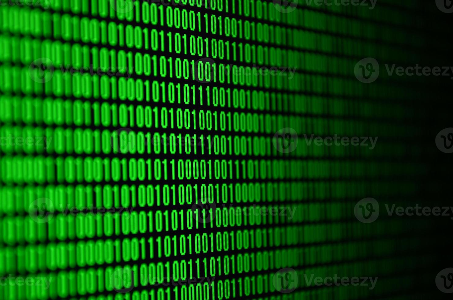 An image of a binary code made up of a set of green digits on a black background photo