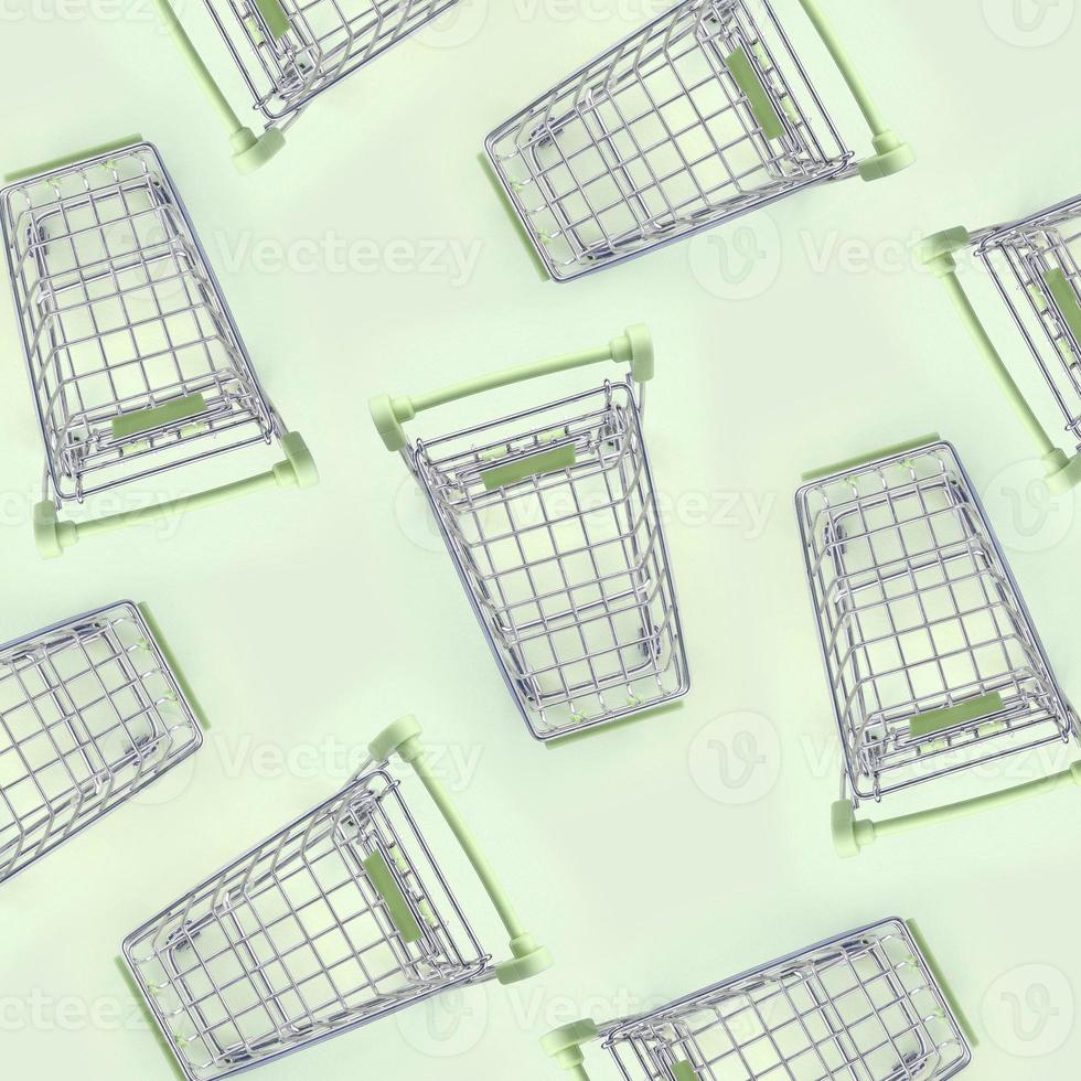 Pattern of many small shopping carts on a lime background photo