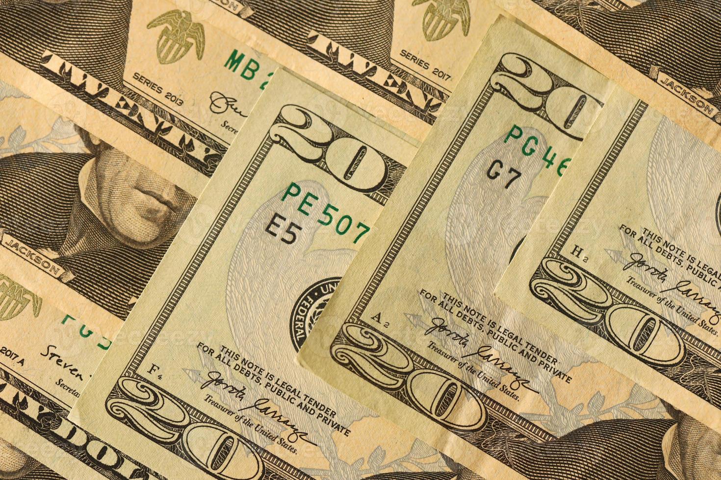 Big amount of old 20 dollar bills details on macro photography. Money earnings, payday or tax paying period photo