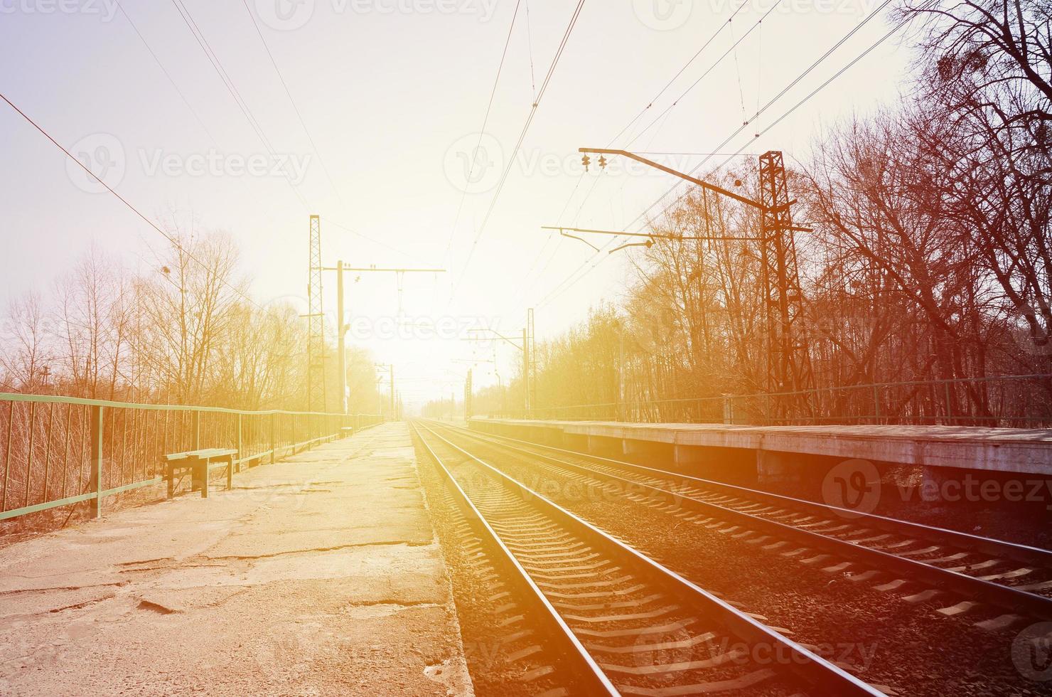 A railway station with platforms for waiting for trains photo