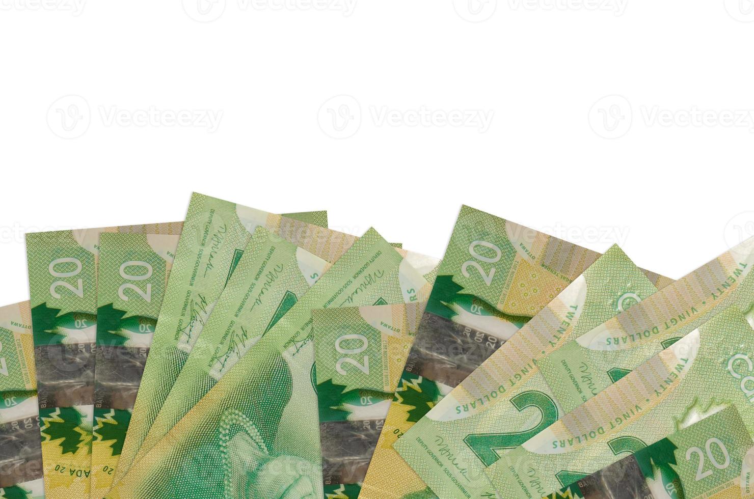 20 Canadian dollars bills lies on bottom side of screen isolated on white background with copy space. Background banner template photo