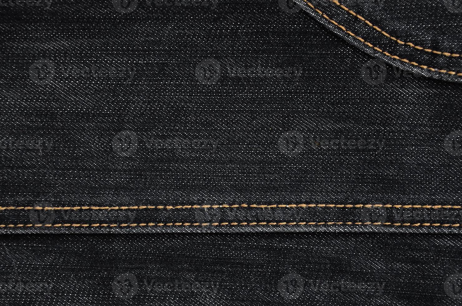 The texture of black denim cloth photo