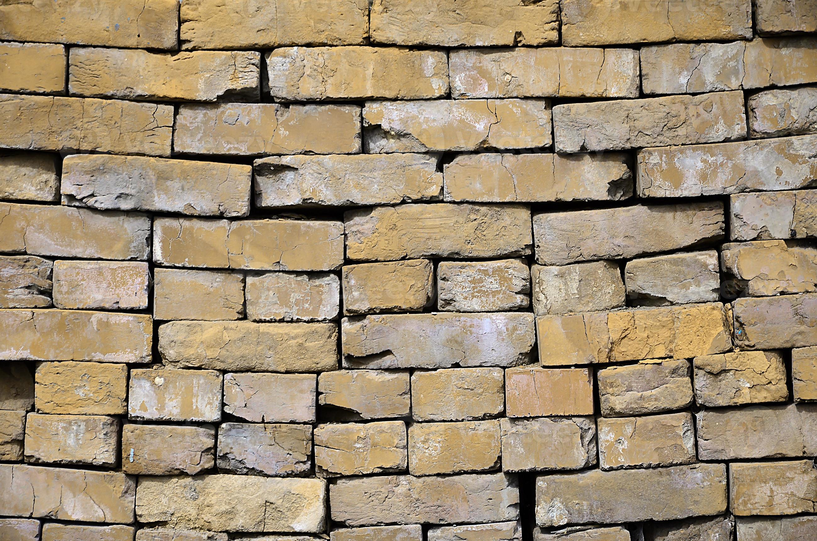 A photo of a set of old bricks that are stacked in a multilayered pile