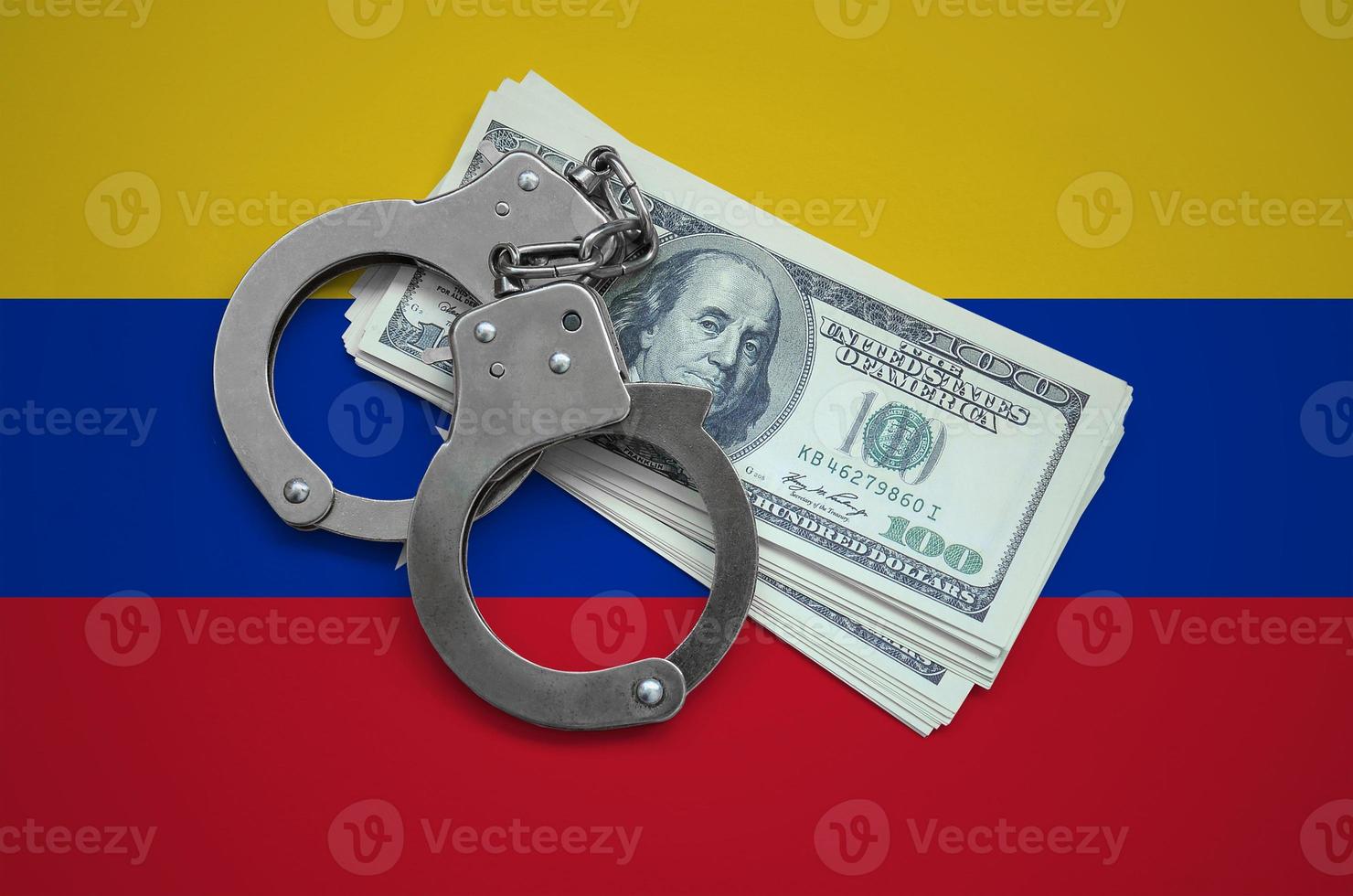Venezuela flag with handcuffs and a bundle of dollars. Currency corruption in the country. Financial crimes photo