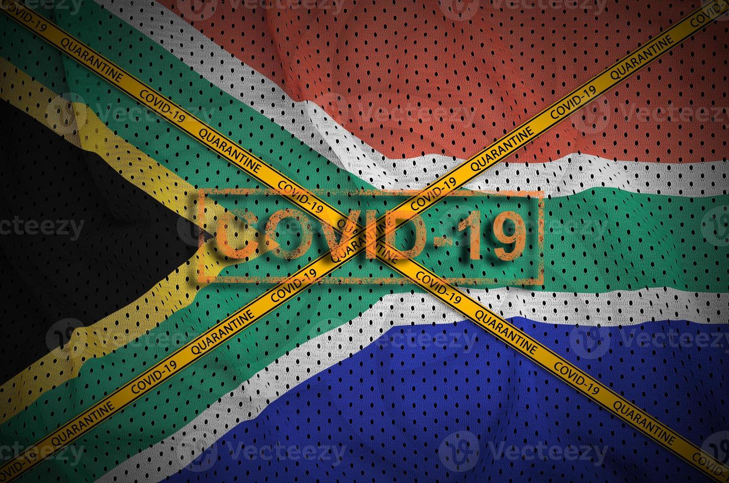 South Africa flag and Covid-19 stamp with orange quarantine border tape cross. Coronavirus or 2019-nCov virus concept photo