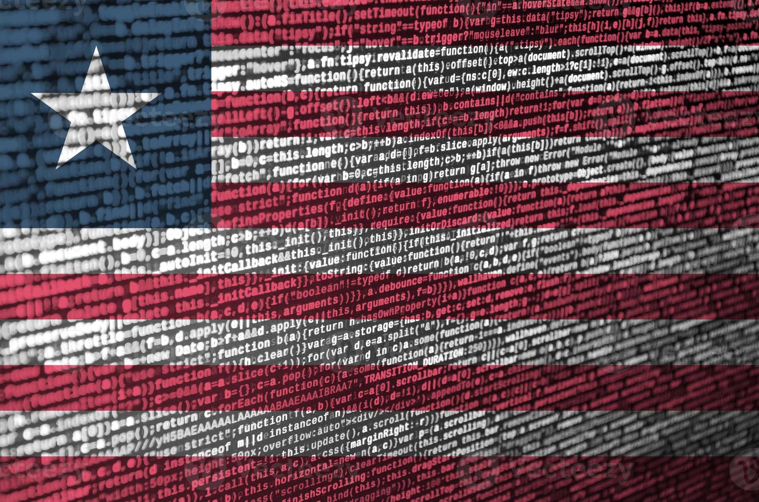 Liberia flag is depicted on the screen with the program code. The concept of modern technology and site development photo