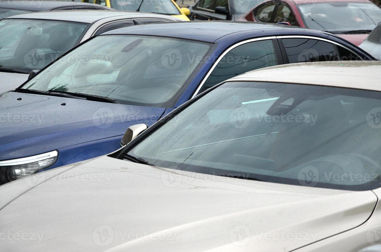 Roofs of several cars. A lot of cars stand close at rush hour photo