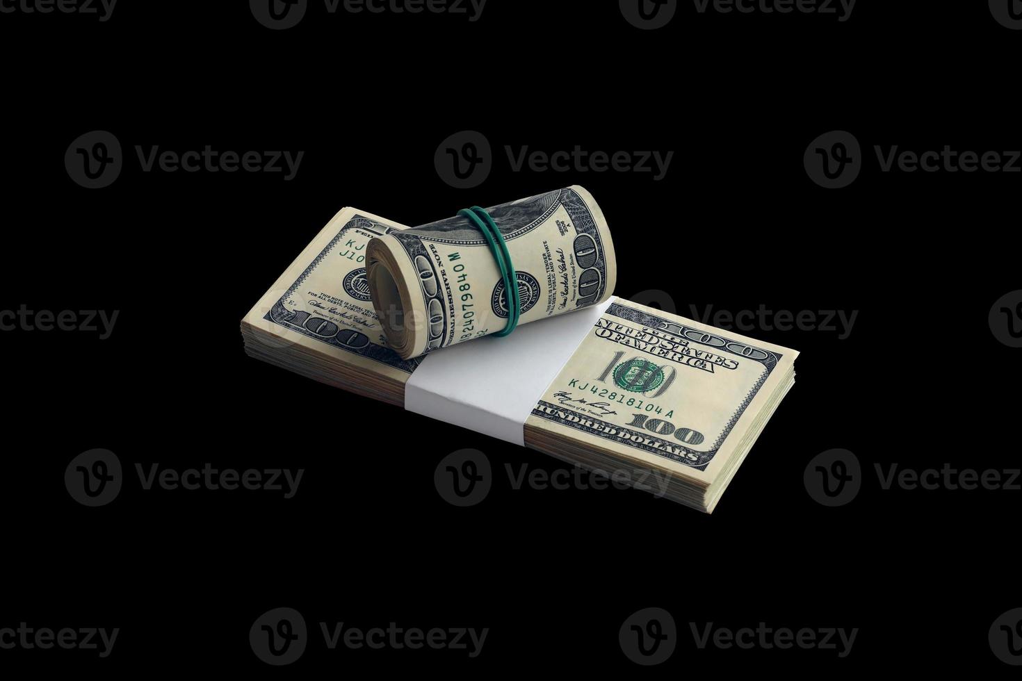 Bundle of US dollar bills isolated on black. Pack of american money with high resolution on perfect black background photo