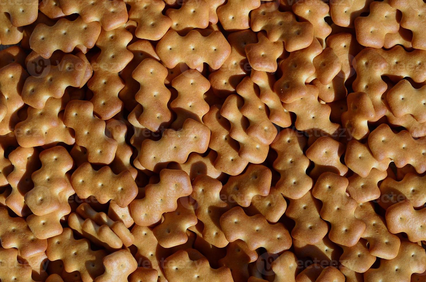 Pattern of a many yellow salted crackers photo