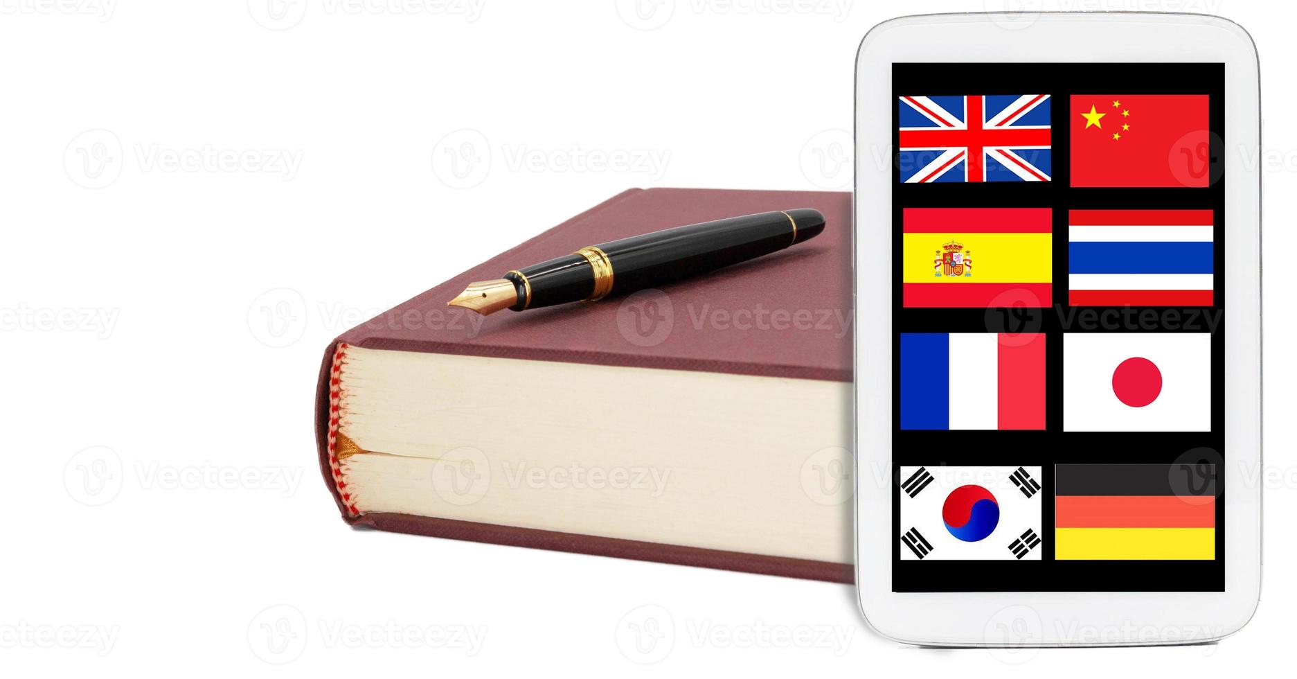 book, pen and tablet with nation flags on white background photo