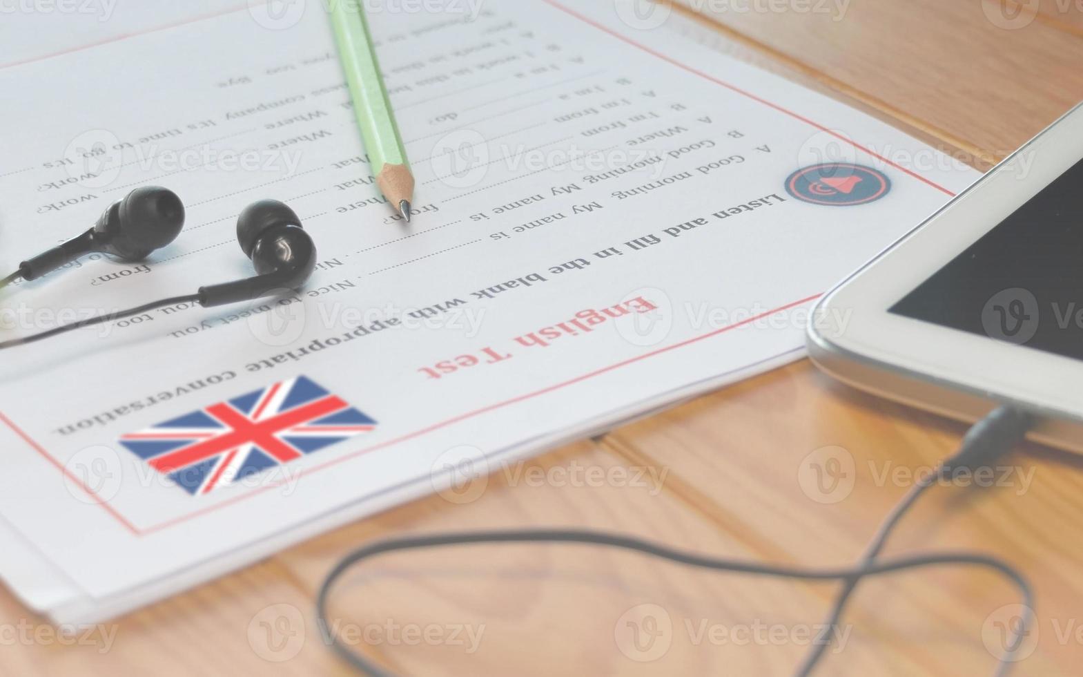 English listening test on wooden desk photo