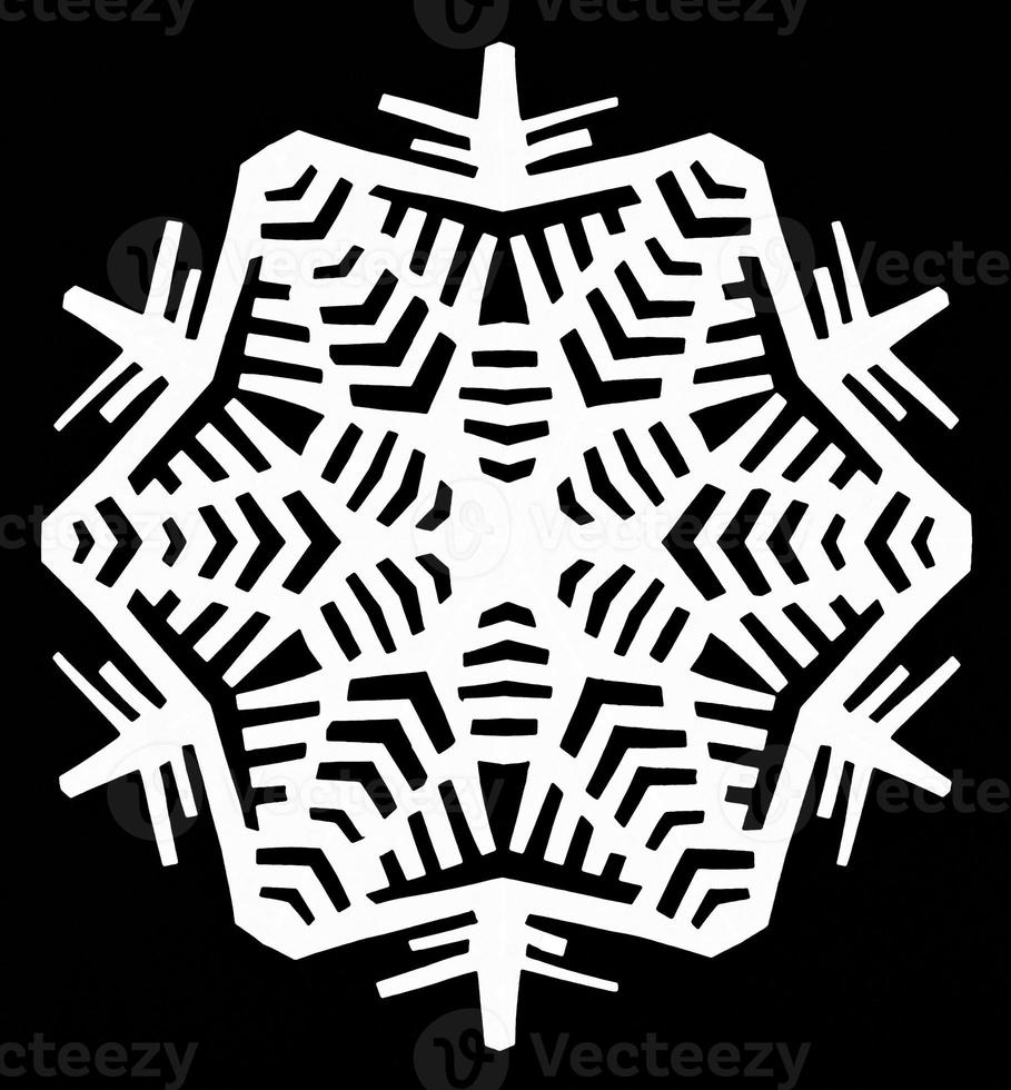 snowflake on black paper photo