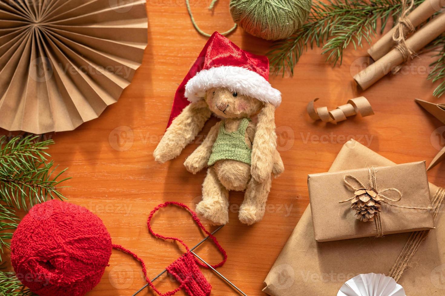 Handmade toy and clothes for it. Flat lay made of toys made by your own for Christmas photo
