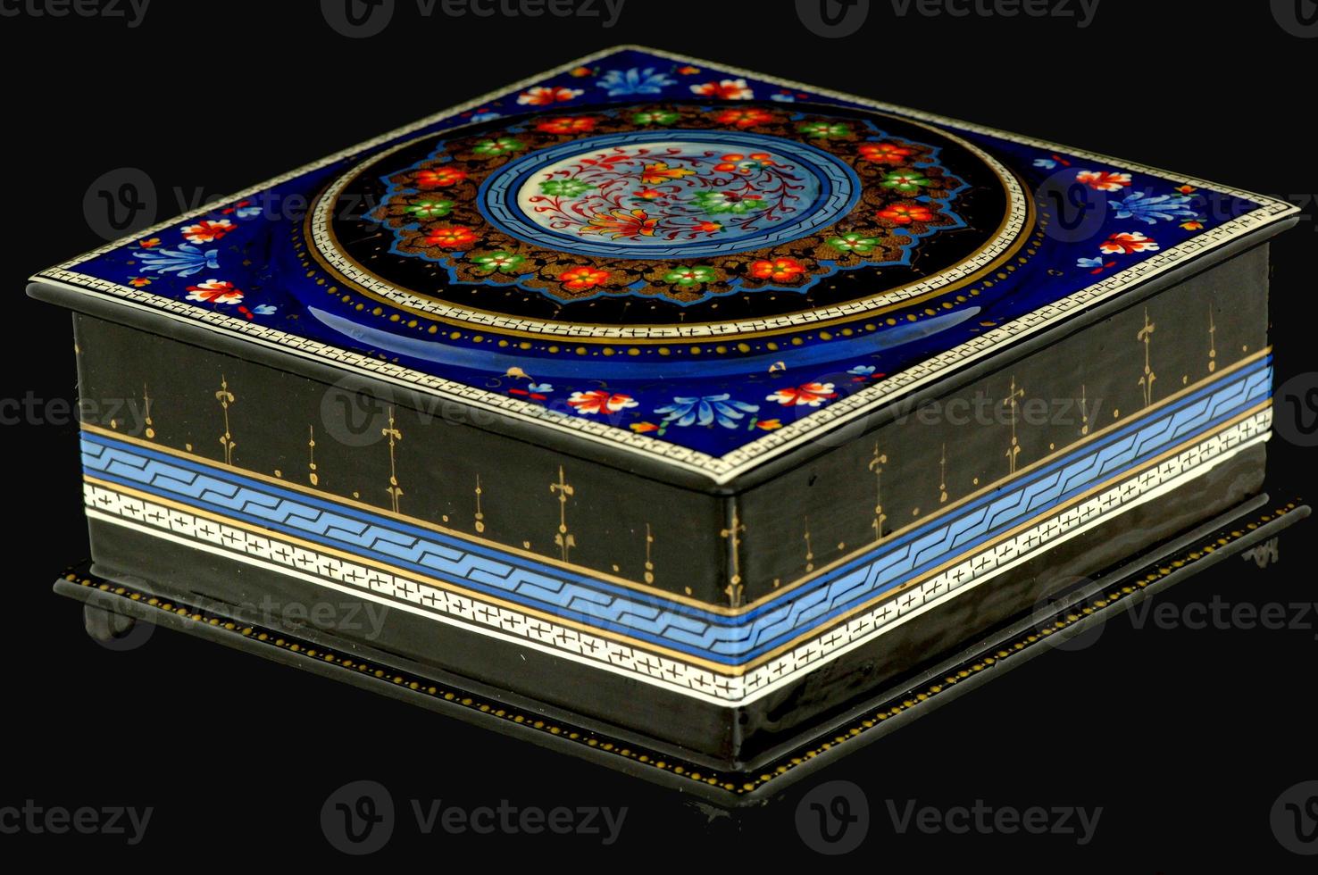 A closeup of a casket with an artistic painting on a black background. Central Asia, Uzbekistan photo