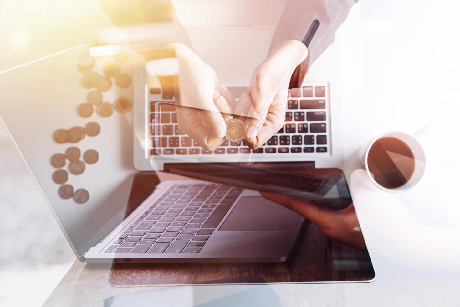 businesswoman hand working with laptop computer, tablet and smart phone in modern office with virtual icon diagram at modernoffice in morning light photo