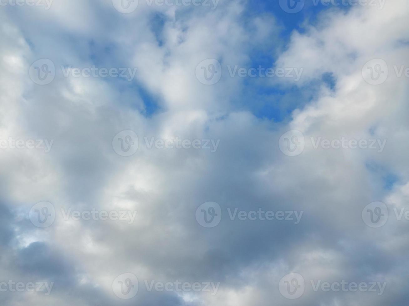 Multi-colored clouds fly over the village photo